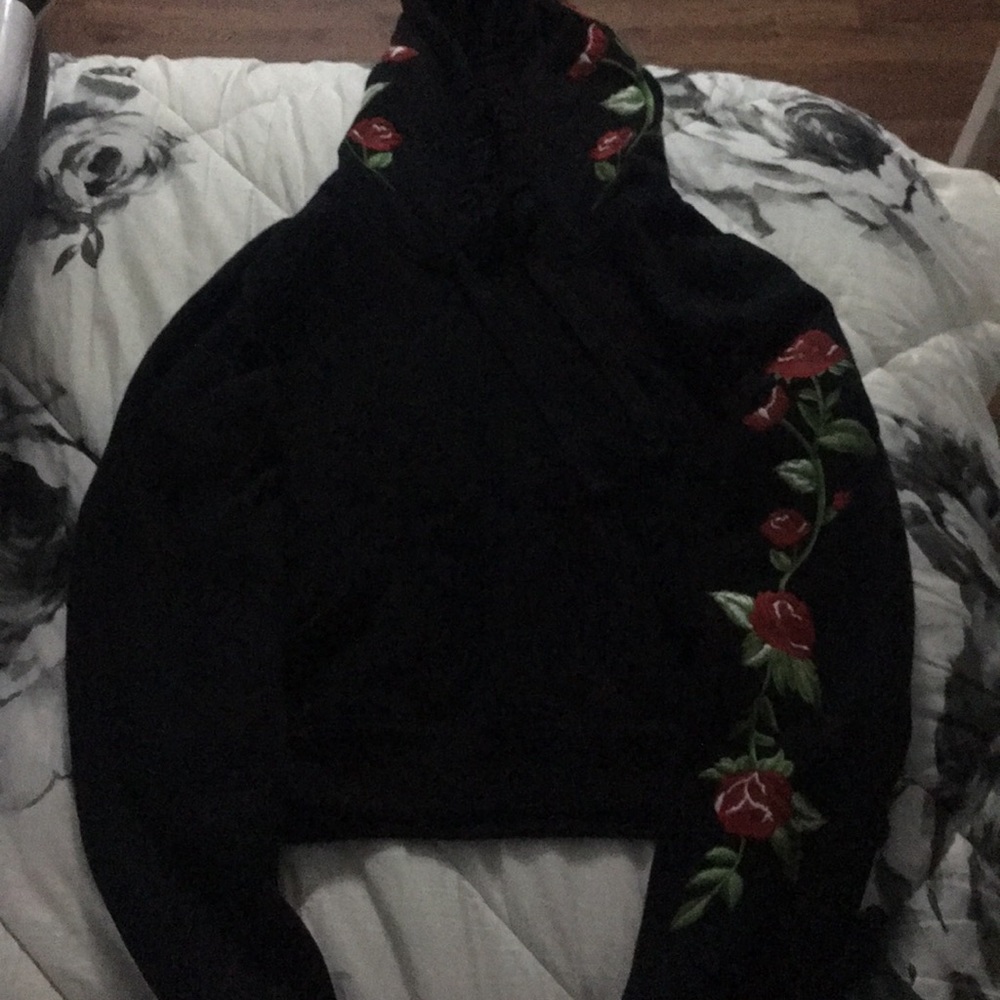 New black hoodie with roses on arm and hood